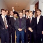 Robert Guthrie and various guitar students. The photo was taken ca. 1992-93 outside of O'Donnell Recital Hall (SMU). The students are (from left to right) Dave Ferrara, Mitch Weverka, Don Fields, Abbas Premjee, Robert Guthrie, Richard Todd, Bryant Russell, Robert Brown, Chis Kenniff.